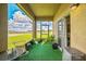 Relax on this screened patio with scenic views of the lush green landscape at 4710 Osprey Way, Winter Haven, FL 33881