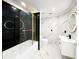 Bathroom with modern single vanity, a black marble walled-in tub, and luxurious gold finishes at 132 Canary Island Cir, Davenport, FL 33837