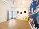 Bright bedroom features a large window and cartoon-themed art at 132 Canary Island Cir, Davenport, FL 33837