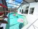Screened-in pool with floaties and access to an outdoor lounge area at 132 Canary Island Cir, Davenport, FL 33837