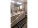Bathroom featuring double sinks and a large mirror at 1704 Felicity Ln, Kissimmee, FL 34744
