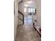 Welcoming entryway featuring tiled floors and stairs to the upper level at 1704 Felicity Ln, Kissimmee, FL 34744