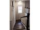 Staircase featuring wooden steps and railing and a modern chandelier at 1704 Felicity Ln, Kissimmee, FL 34744