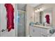 Clean bathroom features a glass shower and a sink with vanity at 311 Bentley Oaks Blvd, Auburndale, FL 33823