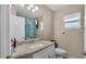 Bright bathroom with granite countertop, modern vanity, and tile backsplash at 311 Bentley Oaks Blvd, Auburndale, FL 33823