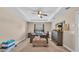 Bright bedroom with a ceiling fan, neutral walls, and a large window at 311 Bentley Oaks Blvd, Auburndale, FL 33823