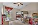 Bedroom with a bunk bed, ceiling fan, and natural light from the window at 311 Bentley Oaks Blvd, Auburndale, FL 33823