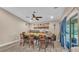 Open dining area with backyard access and a modern ceiling fan at 311 Bentley Oaks Blvd, Auburndale, FL 33823