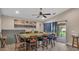 Open dining area with backyard access and a modern ceiling fan at 311 Bentley Oaks Blvd, Auburndale, FL 33823