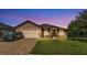 Charming single-story home featuring a brick driveway, a two-car garage, and well-maintained landscaping at 311 Bentley Oaks Blvd, Auburndale, FL 33823