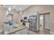 A kitchen featuring granite countertops, stainless steel appliances, and a breakfast bar at 311 Bentley Oaks Blvd, Auburndale, FL 33823