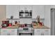 Well-equipped kitchen features modern appliances and a stylish subway tile backsplash at 311 Bentley Oaks Blvd, Auburndale, FL 33823