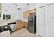 Modern kitchen featuring stainless steel appliances, wood cabinets, and ample counter space at 1760 Mountclair Ct, Mount Dora, FL 32757