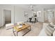 Bright and airy living room featuring modern decor, wood floors, and a ceiling fan at 1760 Mountclair Ct, Mount Dora, FL 32757