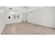 Open living area with plenty of light, neutral paint, and hard surface floors at 1760 Mountclair Ct, Mount Dora, FL 32757