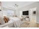 Serene main bedroom with a tray ceiling, ceiling fan, and walk-in closet at 1760 Mountclair Ct, Mount Dora, FL 32757