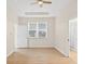 Main bedroom with plank flooring, ceiling fan, and ensuite bathroom at 1760 Mountclair Ct, Mount Dora, FL 32757