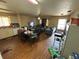 Living room with open kitchen and windows at 2656 Williston Dr, Lakeland, FL 33801