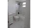 Bright bathroom with stylish vanity, updated lighting, and a shower-tub combo with modern tile at 661 Lake Carolyn Cir, Lakeland, FL 33813