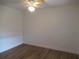 Bright bedroom features modern ceiling fan and sleek, wood-look laminate flooring at 661 Lake Carolyn Cir, Lakeland, FL 33813