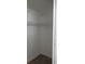 Practical walk-in closet with built-in shelving offering efficient storage solutions at 661 Lake Carolyn Cir, Lakeland, FL 33813