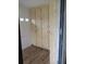 A welcoming entryway features a convenient storage cabinet and wood-look laminate flooring at 661 Lake Carolyn Cir, Lakeland, FL 33813