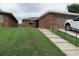 Charming brick home with well-maintained lawn and convenient garage access at 661 Lake Carolyn Cir, Lakeland, FL 33813