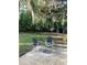 Relaxing backyard area with outdoor seating beneath mature trees at 309 Sunnyside Ln, Debary, FL 32713