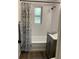 Beautifully renovated bathroom with subway-tiled shower-bath, new fixtures, and modern vanity at 309 Sunnyside Ln, Debary, FL 32713