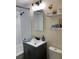 Nicely renovated bathroom with tiled shower-bath, modern vanity, new fixtures, and updated lighting at 309 Sunnyside Ln, Debary, FL 32713