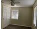 Bedroom featuring light walls, wood-look laminate flooring, closet, and natural light at 309 Sunnyside Ln, Debary, FL 32713