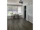 Sunlit dining area featuring hard flooring and a table for two at 309 Sunnyside Ln, Debary, FL 32713