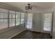 Inviting entryway with lots of natural light from many windows with blinds and wood-look flooring at 309 Sunnyside Ln, Debary, FL 32713