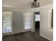 Bright entry foyer with vinyl flooring, wainscotting, and a view to the dining area at 309 Sunnyside Ln, Debary, FL 32713