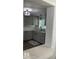 Modern kitchen featuring shaker cabinets, quartz countertops, stainless steel appliances, and wood-look flooring at 309 Sunnyside Ln, Debary, FL 32713