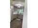 Stylish kitchen featuring modern cabinets, quartz countertops, stainless steel appliances, and wood-look flooring at 309 Sunnyside Ln, Debary, FL 32713