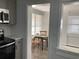 Cozy kitchen with stainless steel appliances and a charming breakfast nook with natural light at 309 Sunnyside Ln, Debary, FL 32713