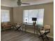 Inviting living room area with wood-look flooring, neutral walls, and many windows that let in a lot of light at 309 Sunnyside Ln, Debary, FL 32713