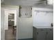 A mud room with overhead cabinet storage and grey counters at 309 Sunnyside Ln, Debary, FL 32713