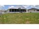 View of backyard and enclosed lanai at 3629 Welsh Way, Lakeland, FL 33813