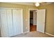 Bedroom with closet and view to bathroom, neutral paint and carpet at 3629 Welsh Way, Lakeland, FL 33813