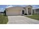 Charming single-story home with a well-maintained lawn and a two-car garage at 3629 Welsh Way, Lakeland, FL 33813