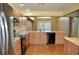 Bright kitchen featuring wood cabinets, stainless steel appliances, and light countertops at 3629 Welsh Way, Lakeland, FL 33813
