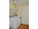 Laundry room featuring a washer and dryer and a wire rack system at 3629 Welsh Way, Lakeland, FL 33813