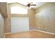 Bright living room with laminate floors, high ceilings, and a ceiling fan at 3629 Welsh Way, Lakeland, FL 33813