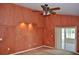 Living room featuring textured walls, ceiling fan, recessed lighting, and sliding door to an enclosed patio at 3629 Welsh Way, Lakeland, FL 33813