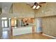 Open living space connecting the kitchen and living area with laminate flooring at 3629 Welsh Way, Lakeland, FL 33813