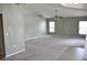 Spacious living room with neutral carpet, high ceilings, and lots of natural light at 3629 Welsh Way, Lakeland, FL 33813