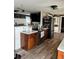 Open kitchen features butcher block countertops, stainless steel appliances and modern cabinetry at 4119 Chambers St, Lake Wales, FL 33898