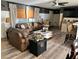 Stylish living room with a comfortable couch, stylish coffee table, and luxury vinyl floors at 4119 Chambers St, Lake Wales, FL 33898